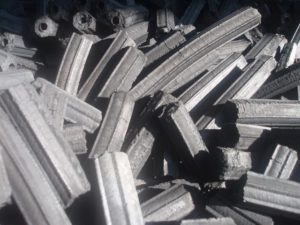 Compressed charcoal briquettes for extended-burn grilling