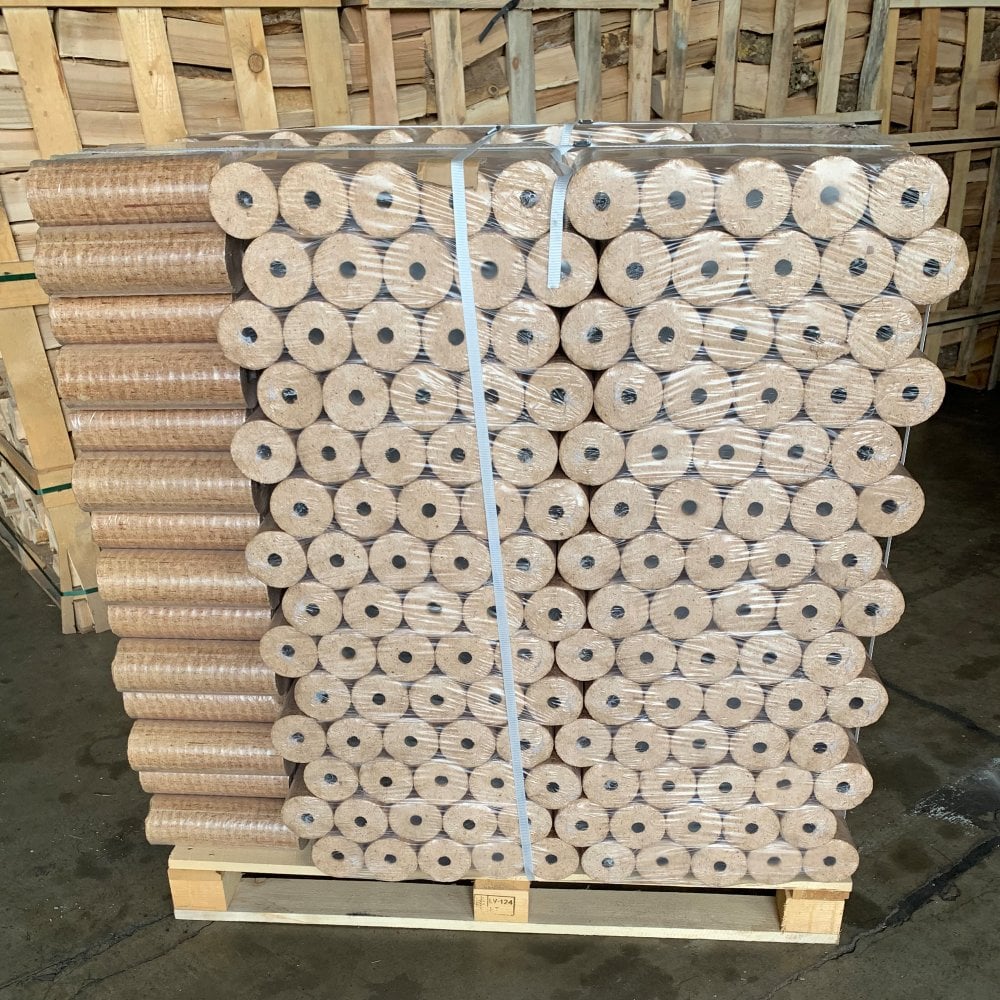 Cylindrical compressed hardwood briquettes stacked for packaging